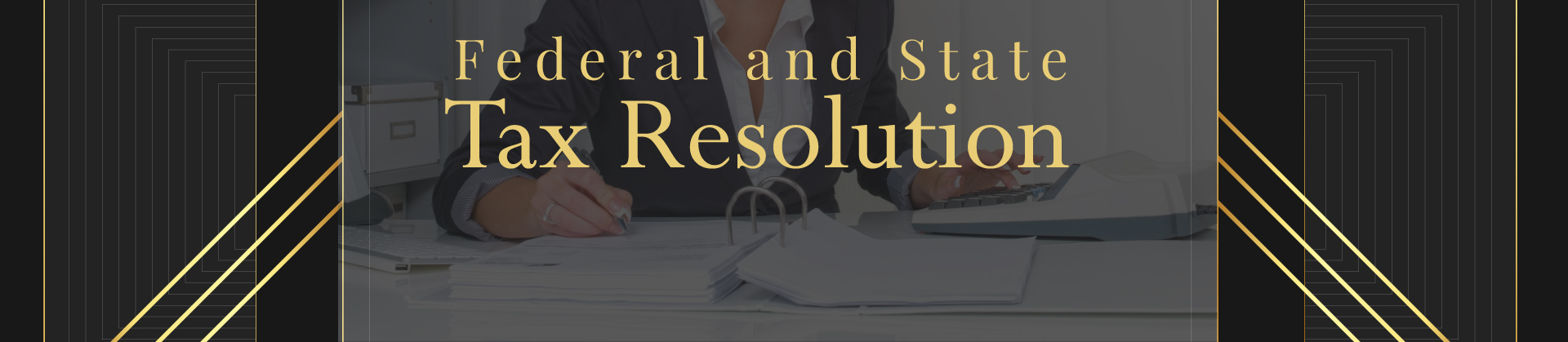 A person working on tax-related paperwork, focusing on federal and state tax resolution